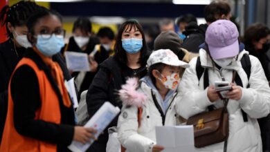 Passengers of a flight from China wait in a line for checking their COVID-19 vaccination documents as a preventive measure against the Covid-19 coronavirus, after arriving at the Paris-Charles-de-Gaulle airport in Roissy, outside Paris, on January 1, 2023. - France and Britain on December 30 joined a growing list of nations imposing Covid tests on travellers from China, after Beijing dropped foreign travel curbs despite surging cases -- and amid questions about its data reporting.