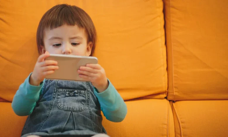 Toddler using smartphone